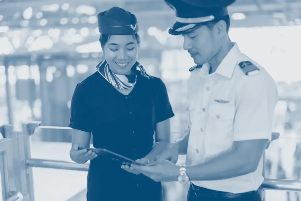 Flight crew coordinating during a pre-flight briefing