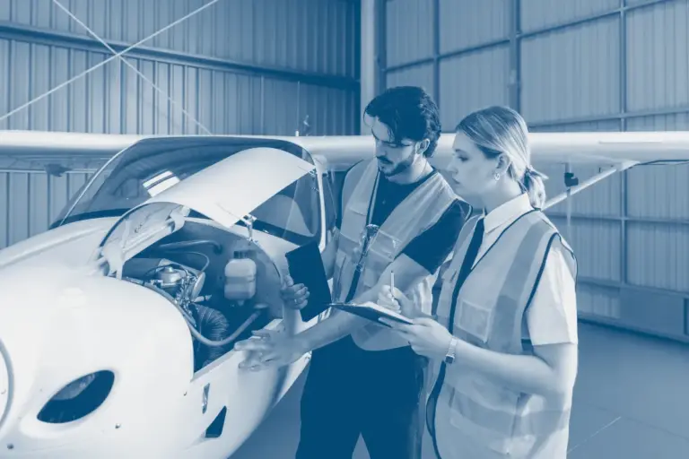 Aircraft maintenance technician engaging with SMS documentation